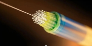 Fiber optic cable end with glowing colorful fibers