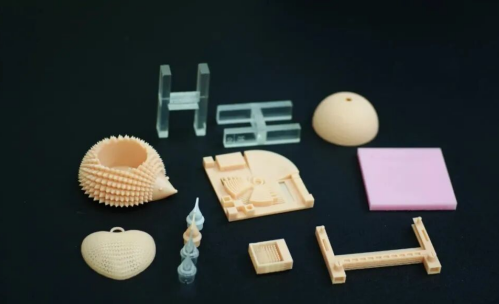 Colorful 3D printed resin parts on dark surface